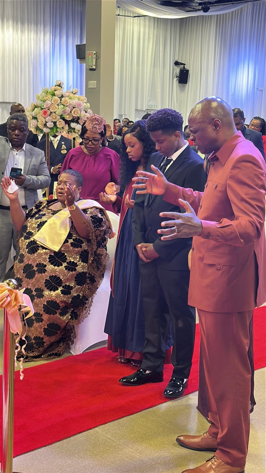 Apostle Mberi and family at a church gathering